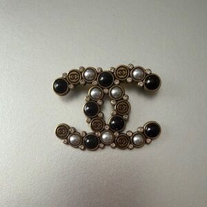 Elegant Designer Black, Gold, and Silver Brooch